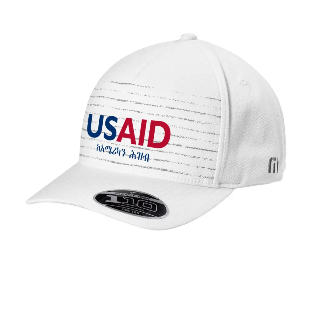 USAID Amharic - Embroidered New TravisMathew FOMO Novelty Cap (Min 12 pcs)