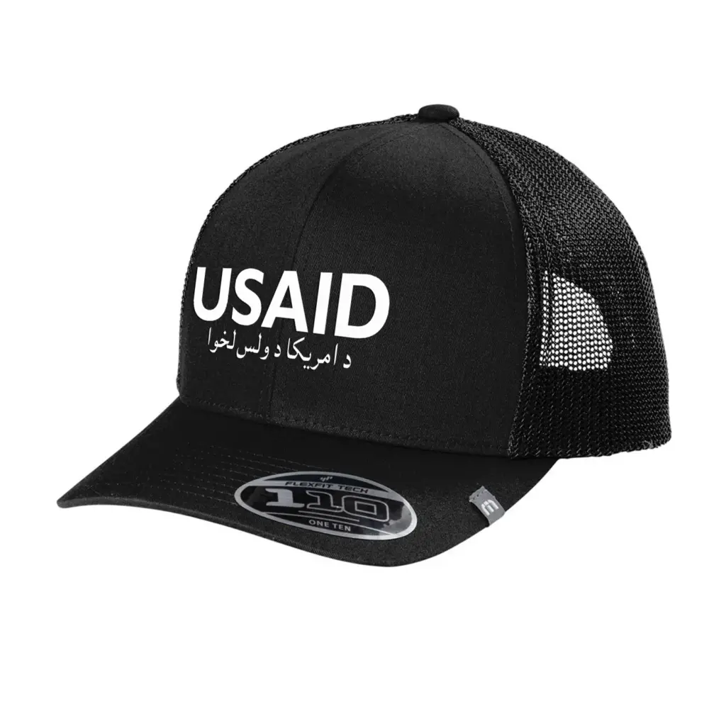 USAID Pashto - Embroidered New TravisMathew Cruz Trucker Cap (Min 12 pcs)